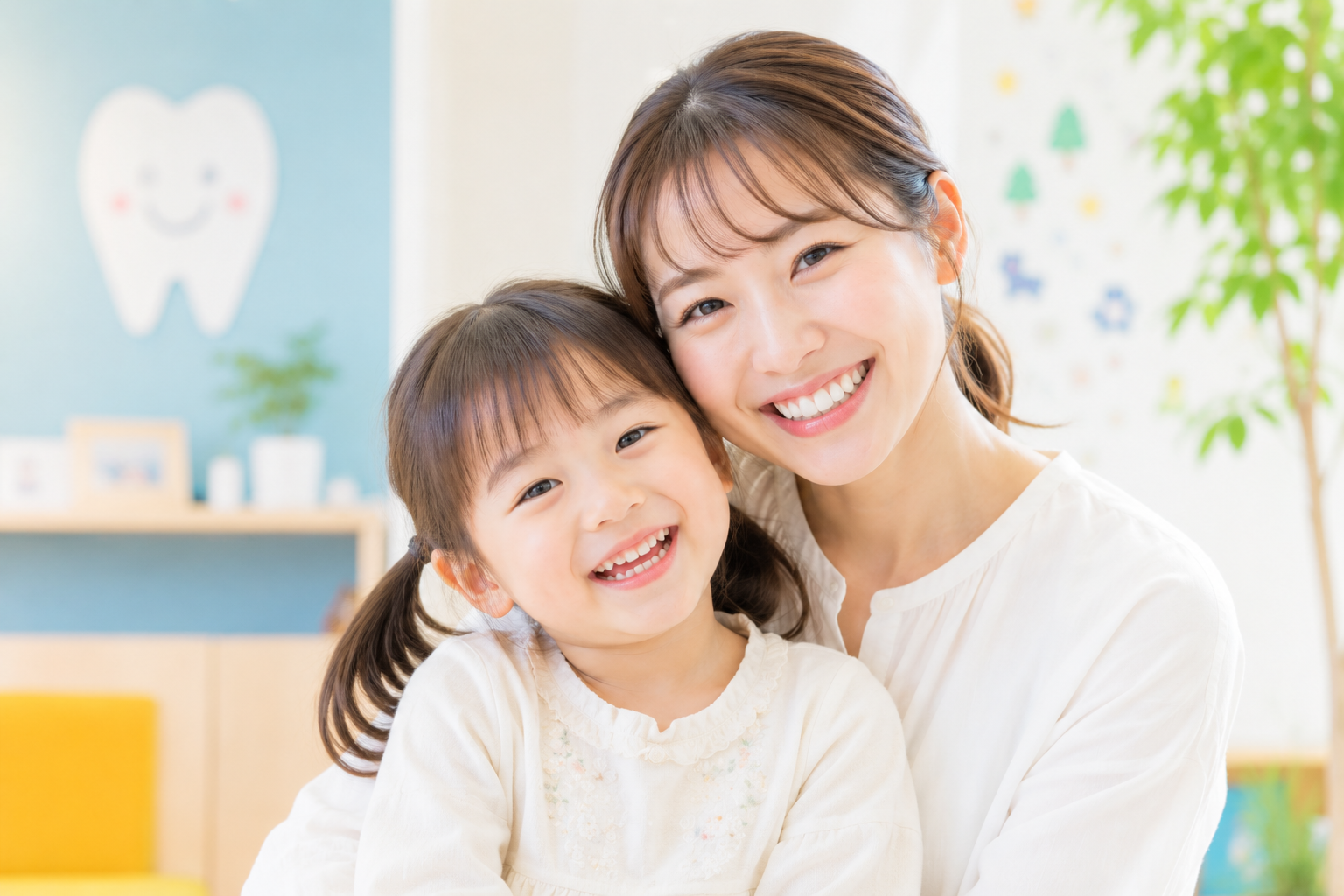 笑顔のお母さんとお子さま